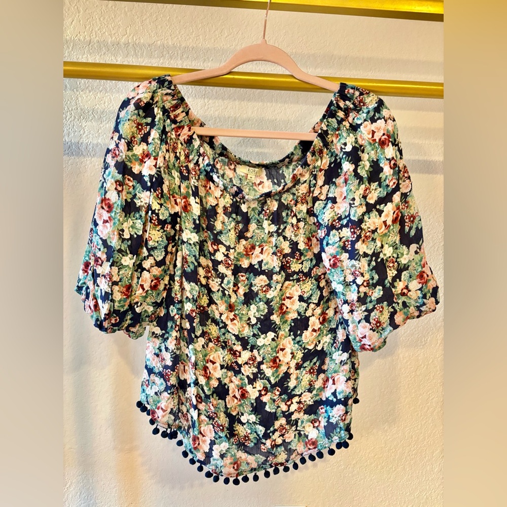 Women’s floral off shoulder blouse with bubble sleeves and pompom hem medium